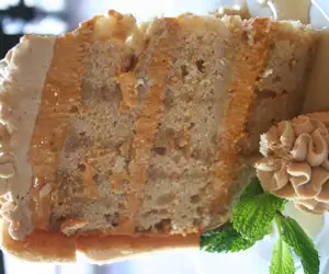 A layered pear cake with buttercream frosting
