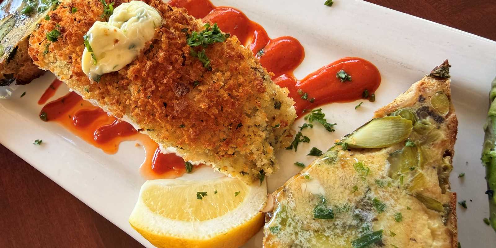 Halibut with a roasted red pepper coulis and mushroom strata